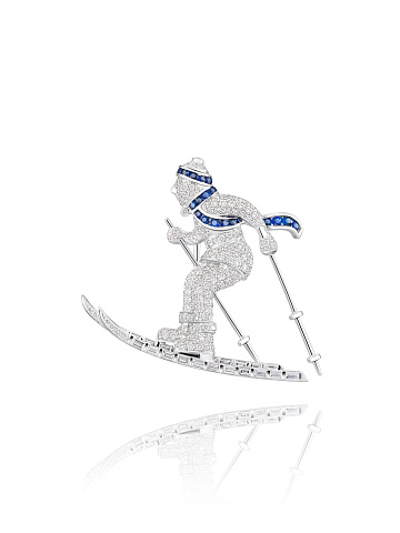 White Gold, Diamonds & Sapphires Skier Brooch, 1