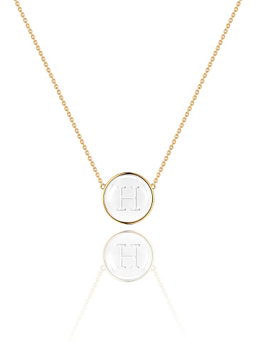 Yellow gold necklace with an H letter pendant and rock crystal, 1