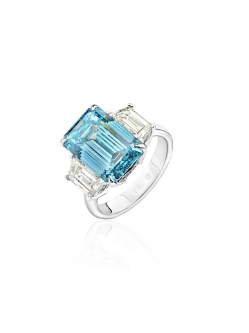 White gold ring with emerald-cut blue diamond, 1